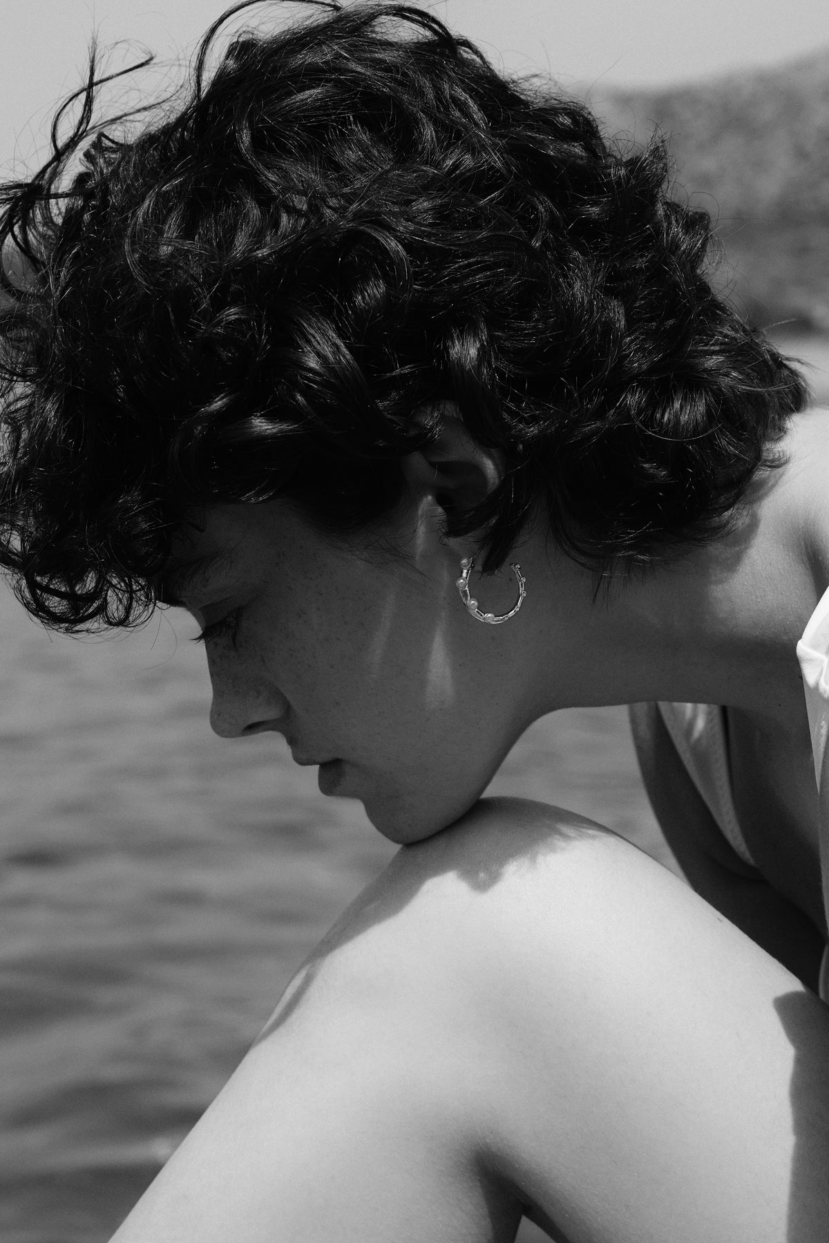 Feggeri hoop earring worn beside the sea