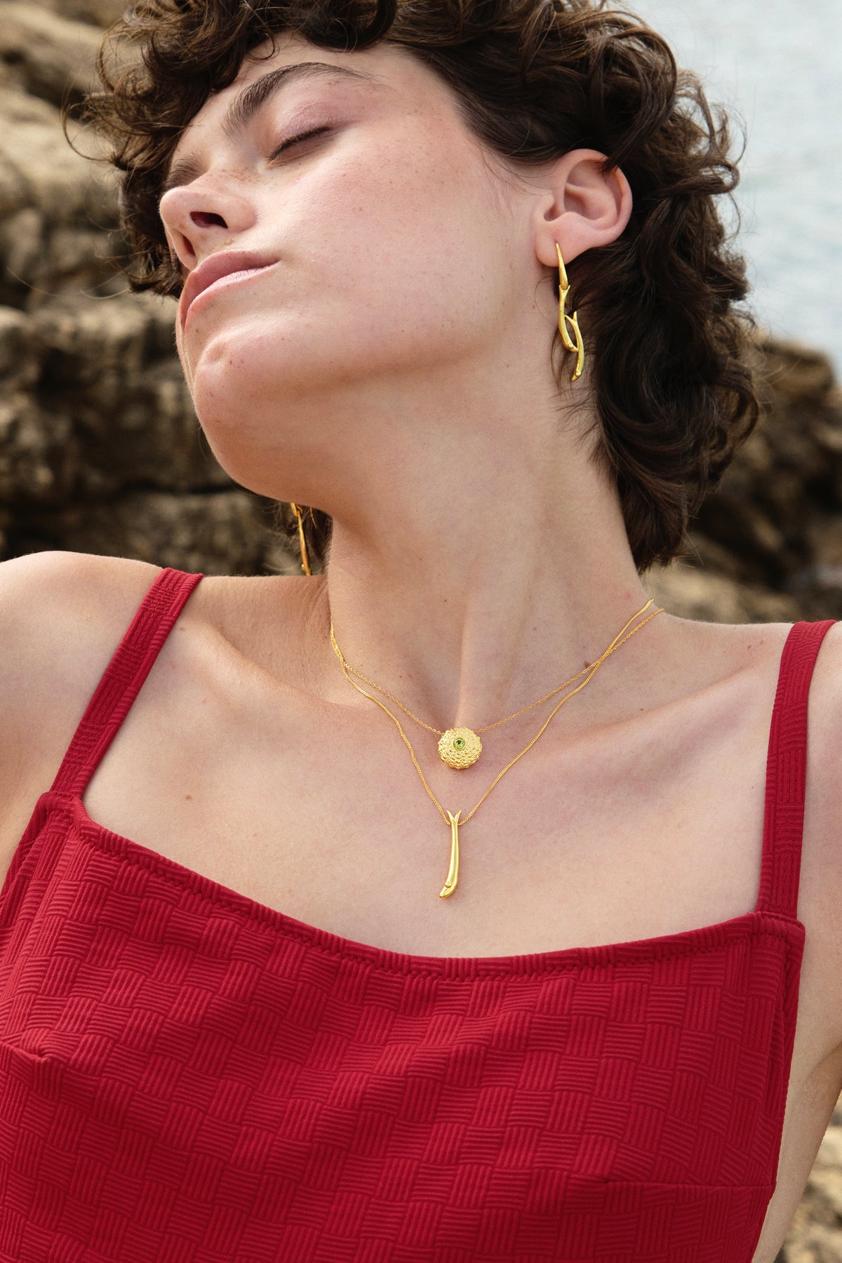 Feggeri Psari fish and Ahinos peridot necklaces in gold vermeil worn together