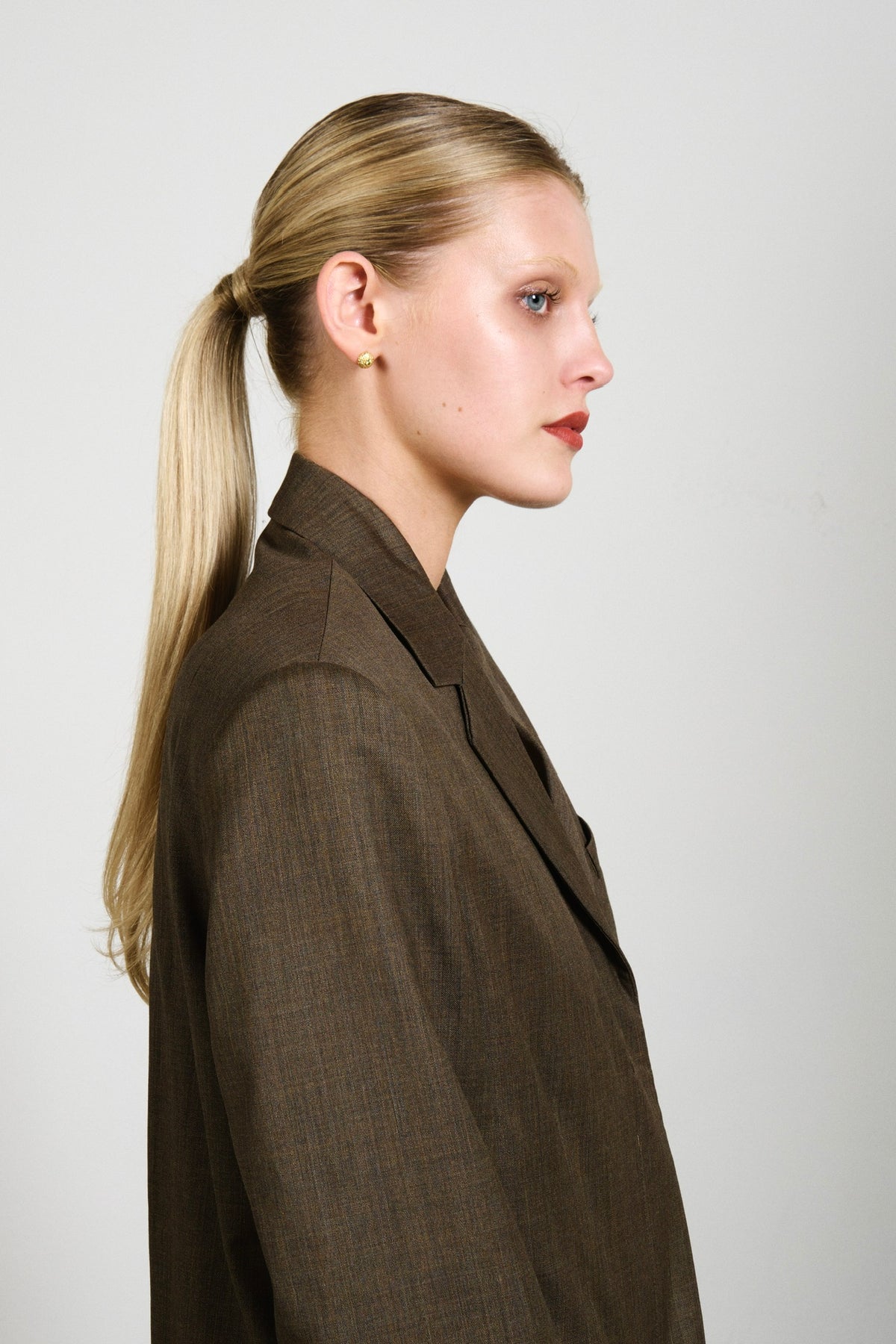 Feggeri Ahinos Gold Vermeil Peridot Stud Earrings worn by a model