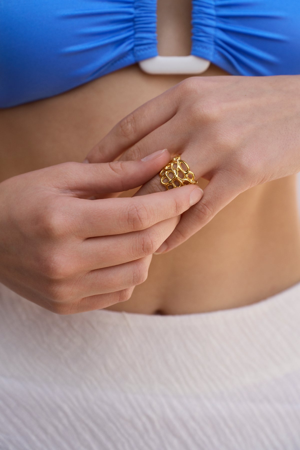 Feggeri Astra Gold Vermeil Starfish Coral Ring worn by a model