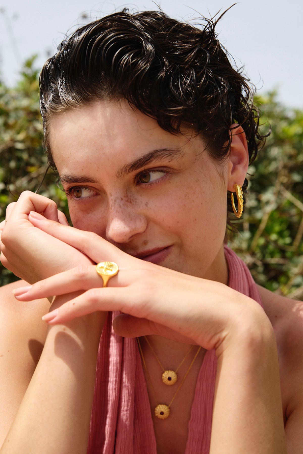 Feggeri Okto Gold Vermeil Large Hoop Earrings worn by a model
