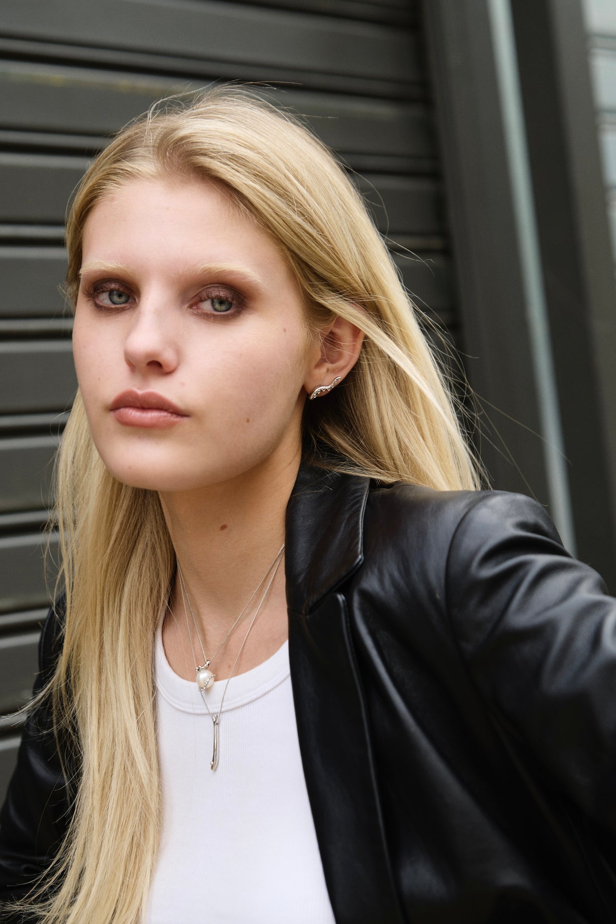 Feggeri Okto pearl and Psari fish necklaces in sterling silver layered together
