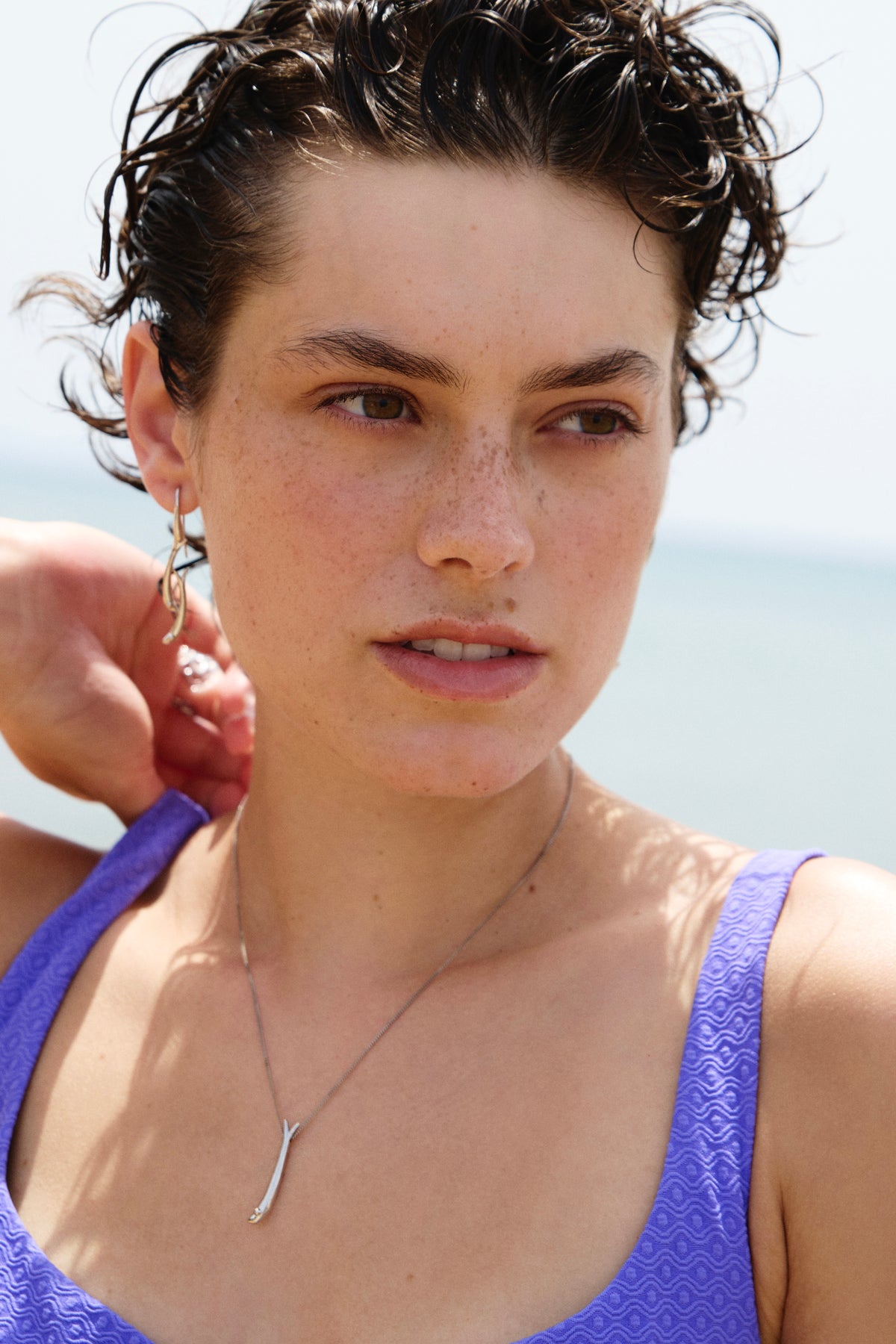 Feggeri Psari Sterling Silver Fish Drop Earrings worn by a model