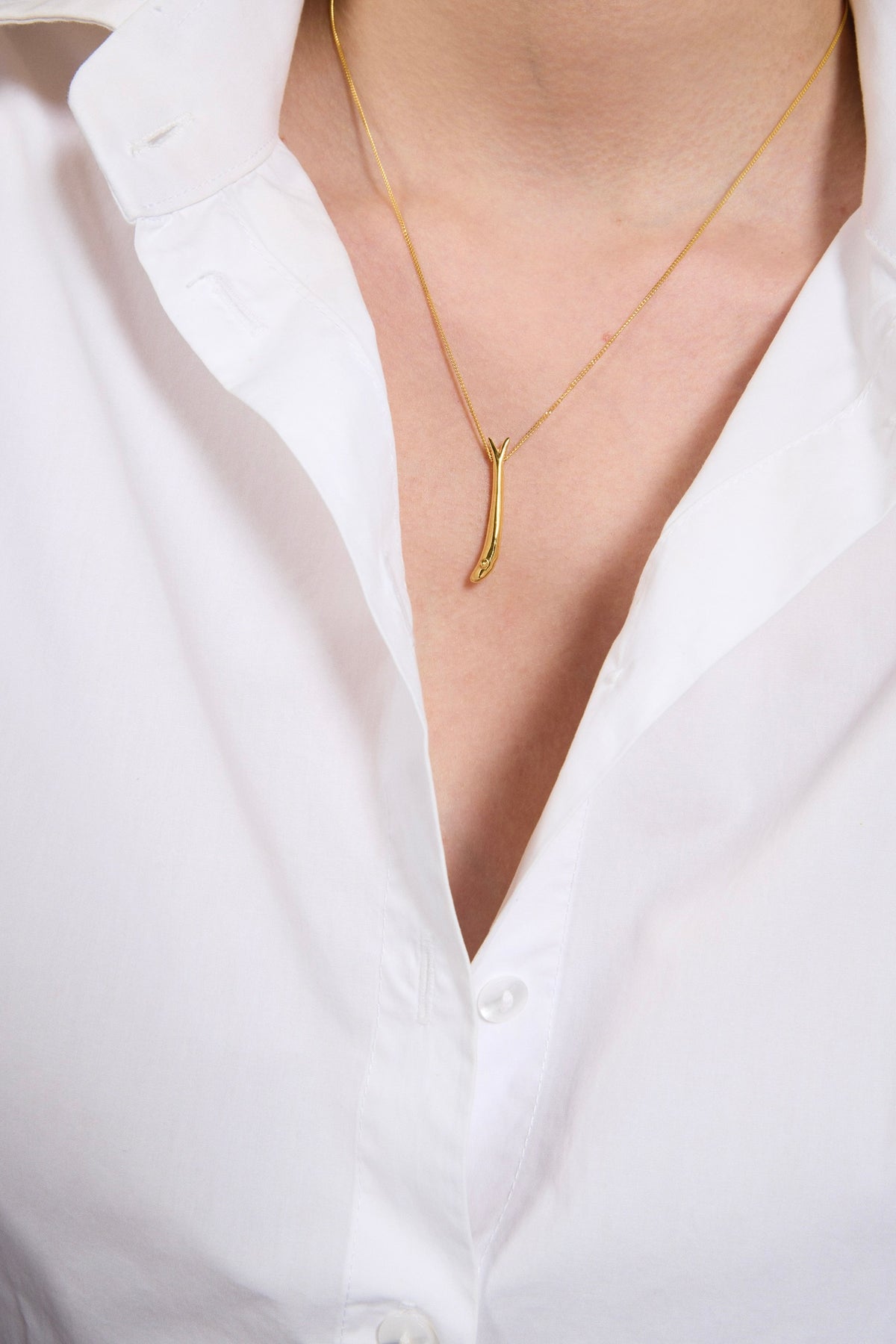 Feggeri Psari Gold Vermeil Fish Necklace worn by a model