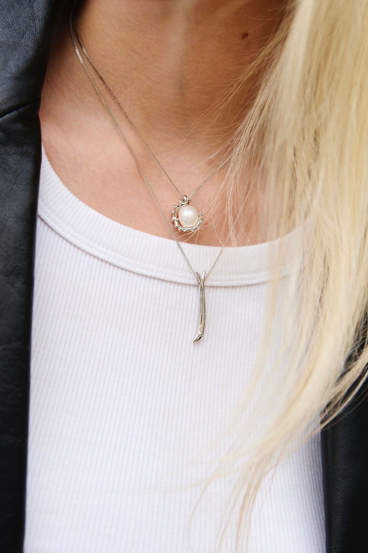 Feggeri Okto pearl and Psari fish necklaces in sterling silver layered together